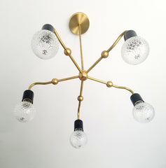 art deco inspired dining room chandelier lighting with brass and black