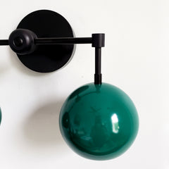 matte black and mermaid green two light wall sconce bathroom lighting