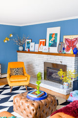 mid mod eclectic living room with a zodiac chandelier