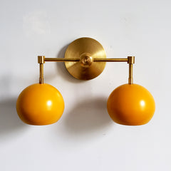 Mustard and Brass two light modern fall colors wall bathroom lighting