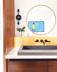 Neutral bathroom design with a navy Medium thalia sconce