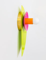 The Kin Sconce in electric chartreuse, vivid doll pink, and punchy orange, designed with bold geometric forms and a central white bulb. A striking example of Memphis-meets-Bauhaus style, this sculptural wall light adds a jolt of color and playful symmetry to modern interiors, eclectic gallery walls, creative studios, or kids' rooms that embrace fearless, design-forward decor.