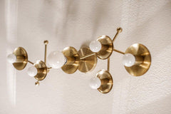 Brass wall sconce shaped like a star sign astrology star sign.  Can be installed on the ceiling or the wall.  Adds a bold geometric look anywhere lighting is needed.