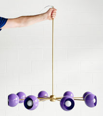 purple and brass mid century modern chandelier by sazerac stitches