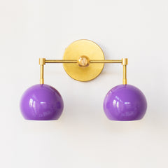 Brass and purple two light wall sconce