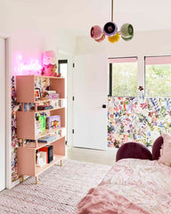 Pastel kids bedroom with an arco chandelier