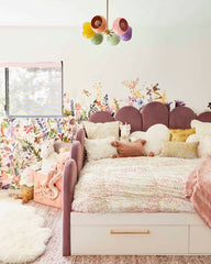 This dreamy kids’ bedroom features a pastel chandelier, floral wallpaper, and cozy textures—showing how color adds warmth and creativity to kids’ spaces. Find more inspiration for colorful nurseries, bedrooms, and playrooms in our blog: 10 Reasons Kids Need Color in Their Interiors.