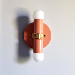 Peach and Brass two light wall sconce