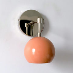 Peach and chrome mid century modern wall sconce