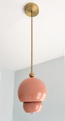 Peach and brass nesting midcentury modern inspired pendant light with nesting shades