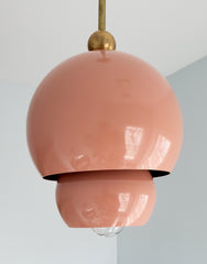 Peach and brass nesting midcentury modern inspired pendant light with nesting shades