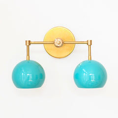 Aqua blue and brass two light mid century  modern wall sconce