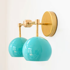 Aqua blue and brass two light mid century  modern wall sconce