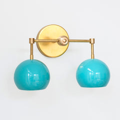 Aqua blue and brass two light mid century  modern wall sconce