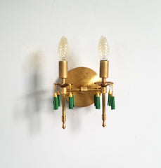 Modern victorian wall lighting sconce features cast gold brass bobeches and green beaded tassels