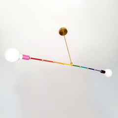 mid century modern inspired rainbow chandelier with colorful segments and brass accents