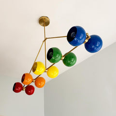 Large rainbow and brass chandelier with ROYGBIV colors.  Playroom kids room lighting