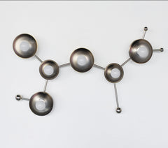 Chrome Sagittarius sconce inspired by astrological star zodiac