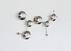 Chrome Sagittarius sconce inspired by astrological star zodiac