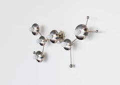 Chrome Sagittarius sconce inspired by astrological star zodiac