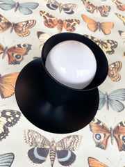 black modern wall sconce with monochromatic colors