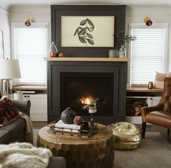 Neutral Living room with adjustable wall sconces above the windows