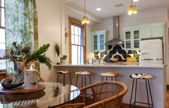 boho style kitchen with yellow pendant lights and rattan furniture