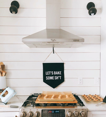 farmhouse kitchen view with white shiplap and matte black wall sconces by Sazerac Stitches