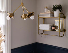 Brass floral chandelier in a bathroom