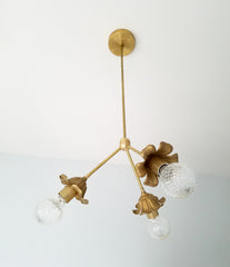gold parisian style chandelier lighting interior design brass flowers