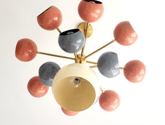 Solaris chandelier with coral grey and cream light shades mid century modern inspired southwestern colors