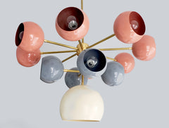 Solaris chandelier with coral grey and cream light shades mid century modern inspired southwestern colors