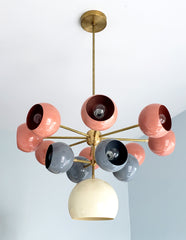 Solaris chandelier with coral grey and cream light shades mid century modern inspired southwestern colors