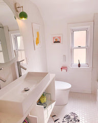 Spring green and chrome modern bathroom renovation with white tile and pops of color