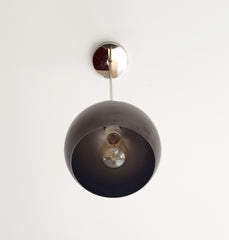 chrome and steel pendant lighting industrial style with a midcentury modern shaped globe pendant