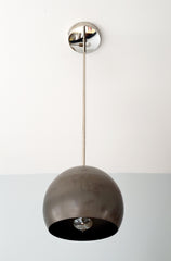 chrome and steel pendant lighting industrial style with a midcentury modern shaped globe pendant