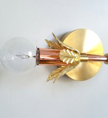 brass and polished copper wall sconce bathroom lighting modern design mixed metal interior