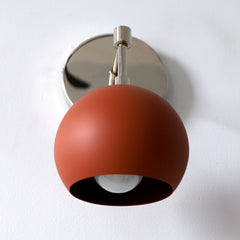 Terra cotta mid century modern wall sconce with chrome accents