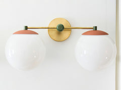 terra cotta, olive, and brass neutral boho colors color blocked two light bathroom vanity light