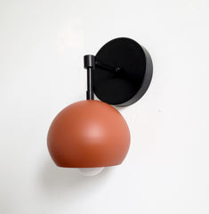 terra cotta and black modern single eyeball shade wall sconce modern lighting
