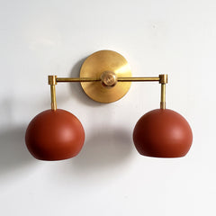 Brass and terra cotta wall sconce two light fixture
