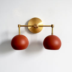 Brass and terra cotta wall sconce two light fixture