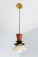 Neutral space style pendant with terra cotta, black, and cream accents