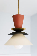 Neutral space style pendant with terra cotta, black, and cream accents