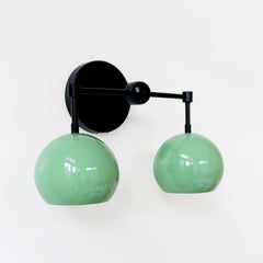 black and green two light mid century modern wall sconce by sazerac stitches