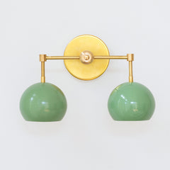 Pastel Green and brass two light mid century modern wall sconce