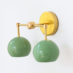 Pastel Green and brass two light mid century modern wall sconce