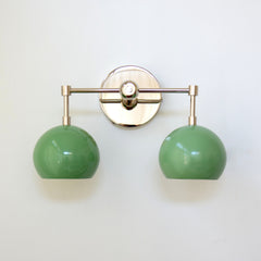 two light pastel green and chrome two light wall sconce