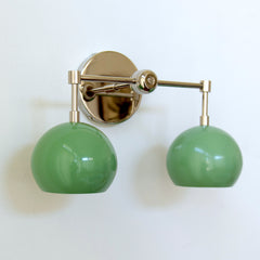 two light pastel green and chrome two light wall sconce