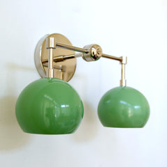 two light pastel green and chrome two light wall sconce